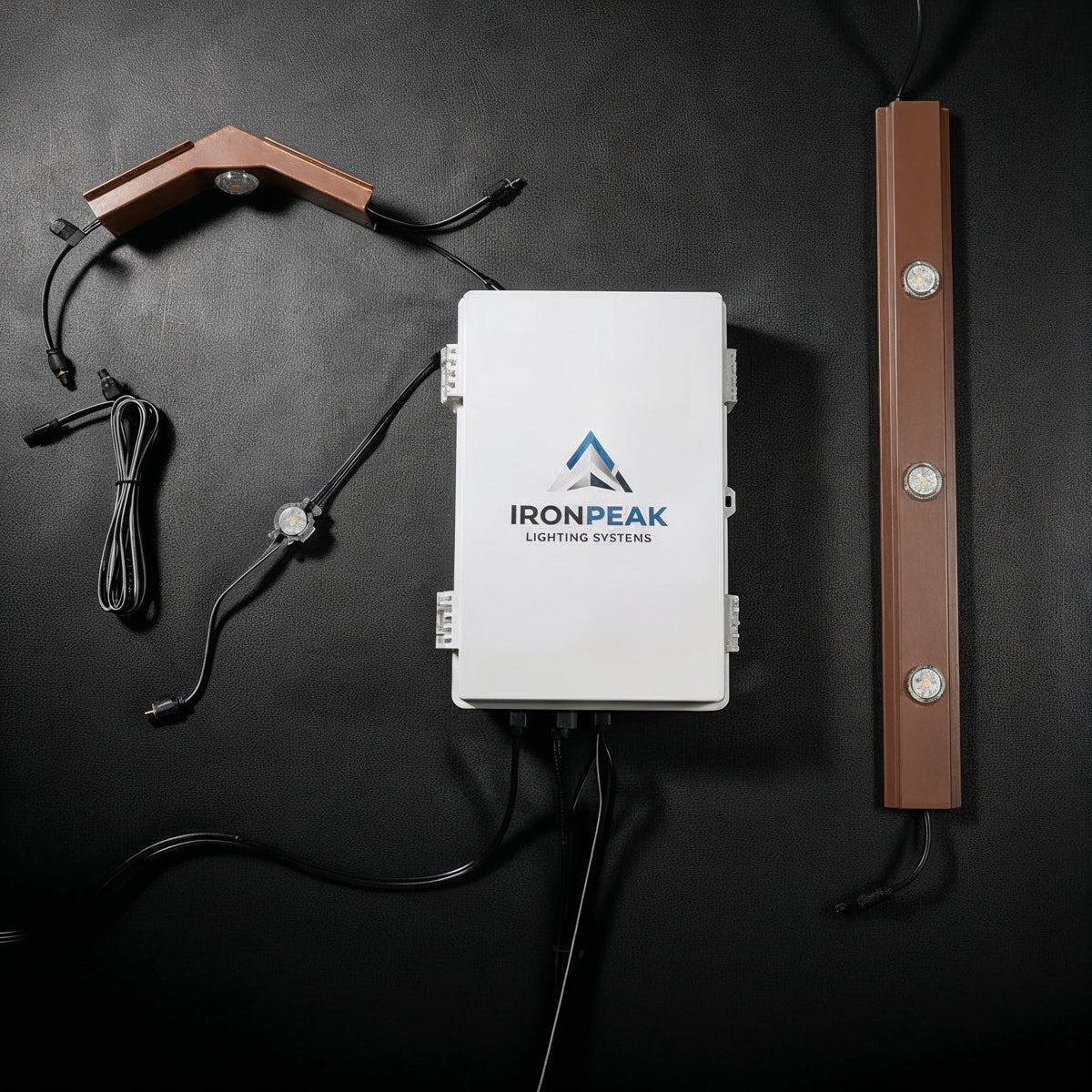 300 ft Full-Perimeter Kit — controller, track runs and three pre-built Apex peaks on a dark studio background